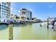 Scenic water view of docks, boats, and buildings, creating a serene waterfront setting at 2 Seaside Ln # 801, Belleair, FL 33756