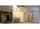 Open-concept living room featuring high ceilings, a ceiling fan, and easy access to the kitchen at 21544 Clubside Loop, Lutz, FL 33549
