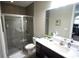 Contemporary bathroom featuring a glass shower, marble countertops, and modern fixtures at 2575 W Platt St, Tampa, FL 33609
