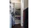 Walk-in closet with built-in shelving, hanging racks and shoe storage at 2575 W Platt St, Tampa, FL 33609