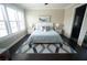 Tranquil main bedroom with plush bedding, decorative pillows, and an ensuite bathroom at 2575 W Platt St, Tampa, FL 33609