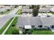 View of a well-maintained home with new gray roof, manicured lawn, and an enclosed lanai at 2937 Stilwell Ct, New Port Richey, FL 34655
