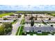 Wide aerial perspective of a peaceful neighborhood with neatly arranged homes and lush green spaces at 2937 Stilwell Ct, New Port Richey, FL 34655