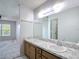 Bathroom featuring a vanity with sink and view into the bedroom at 2937 Stilwell Ct, New Port Richey, FL 34655