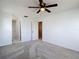 Bright bedroom with neutral carpet and ceiling fan at 2937 Stilwell Ct, New Port Richey, FL 34655