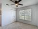 Comfortable bedroom featuring carpet flooring, a ceiling fan, and a closet at 2937 Stilwell Ct, New Port Richey, FL 34655
