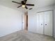 Bedroom with carpet flooring, ceiling fan, and closet at 2937 Stilwell Ct, New Port Richey, FL 34655