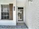 Close-up of the front entrance of a home, showing address and decorative tile at 2937 Stilwell Ct, New Port Richey, FL 34655
