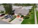 Charming single-story home showcasing a well-manicured lawn, mature trees, and a spacious driveway at 2937 Stilwell Ct, New Port Richey, FL 34655