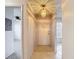 Bright hallway with ceramic floors and a contemporary light fixture at 2937 Stilwell Ct, New Port Richey, FL 34655