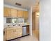 Kitchen area featuring stainless steel appliances, double sink and tile backsplash at 2937 Stilwell Ct, New Port Richey, FL 34655