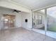 Enclosed patio featuring tile flooring and access to the backyard at 2937 Stilwell Ct, New Port Richey, FL 34655