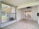 The screened-in patio includes a ceiling fan and tiled floor at 2937 Stilwell Ct, New Port Richey, FL 34655