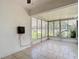 Enclosed sunroom featuring tile floors and lots of natural light at 2937 Stilwell Ct, New Port Richey, FL 34655