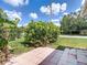 Landscaped yard with view to street at 2937 Stilwell Ct, New Port Richey, FL 34655