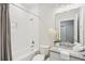 Bright bathroom with tiled shower/tub combination, granite countertop and decorative plant at 3114 E 21St Ave, Tampa, FL 33605
