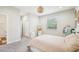 This cozy bedroom features neutral tones and a large window providing natural light and a decorative light fixture at 3114 E 21St Ave, Tampa, FL 33605