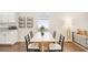 Bright dining area featuring a light wood table, seating for six, and storage baskets at 3114 E 21St Ave, Tampa, FL 33605
