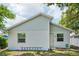 Back exterior of the home featuring windows and siding at 3114 E 21St Ave, Tampa, FL 33605