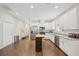 Modern kitchen featuring stainless appliances, rolling island, granite countertops, and ample cabinet space at 3114 E 21St Ave, Tampa, FL 33605