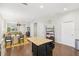 Open-concept view showcasing the kitchen's island and breakfast nook, seamlessly connecting to the living area at 3114 E 21St Ave, Tampa, FL 33605