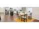 Bright, open kitchen with stainless steel appliances and a dining table set for four at 3114 E 21St Ave, Tampa, FL 33605