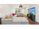 Modern living space with a comfortable sectional sofa and stylish decor at 3114 E 21St Ave, Tampa, FL 33605