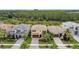 Aerial view of homes with lush landscaping, surrounded by mature trees at 32203 Mahogany Valley Dr, Wesley Chapel, FL 33543