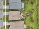 Birds eye view of roofs with a pool, playground, and patio area at 32203 Mahogany Valley Dr, Wesley Chapel, FL 33543