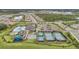 Birds eye view of community amenities with a pool, tennis courts, and playground at 32203 Mahogany Valley Dr, Wesley Chapel, FL 33543