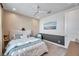 Comfortable bedroom with a geometrically patterned accent wall, plush bed, and serene artwork at 32203 Mahogany Valley Dr, Wesley Chapel, FL 33543