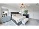Well-lit bedroom with neutral colors, modern fixtures, and stylish bedside tables at 32203 Mahogany Valley Dr, Wesley Chapel, FL 33543