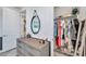 Well-organized walk-in closet with ample storage, clothing racks, and shelves, located off the main bedroom at 32203 Mahogany Valley Dr, Wesley Chapel, FL 33543