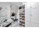 Custom closet with built-in shelving and drawers to organize shoes and accessories at 32203 Mahogany Valley Dr, Wesley Chapel, FL 33543