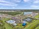 Aerial view of clubhouse, pool, playground and tennis courts at 32203 Mahogany Valley Dr, Wesley Chapel, FL 33543
