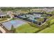 Aerial view of basketball court, pickleball courts, and community landscaping at 32203 Mahogany Valley Dr, Wesley Chapel, FL 33543