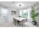 Dining room with a large window providing natural light and views of the backyard at 32203 Mahogany Valley Dr, Wesley Chapel, FL 33543