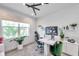 Modern office space with unique lighting, a spacious desk, and a comfortable ergonomic chair at 32203 Mahogany Valley Dr, Wesley Chapel, FL 33543