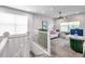 Upstairs office area with modern decor, comfortable seating, and bright natural light at 32203 Mahogany Valley Dr, Wesley Chapel, FL 33543