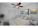 Cozy bedroom with ceiling fan, closet, and window offering natural light at 3411 Glossy Ibis Ct, Palm Harbor, FL 34683