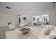 Spacious living area featuring neutral decor, tile flooring, and an open layout at 3411 Glossy Ibis Ct, Palm Harbor, FL 34683