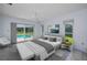 Comfortable main bedroom with pool view, ceiling fan, and neutral decor at 3411 Glossy Ibis Ct, Palm Harbor, FL 34683