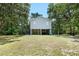 View of a two-story home featuring a spacious yard and ample outdoor area at 34147 Ringwalt Dr, Dade City, FL 33523
