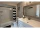Bathroom featuring a shower-tub combo, decorative shower curtain, white vanity, and mirror at 3803 43Rd N Ave, St Petersburg, FL 33714