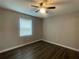 Neutral bedroom features ceiling fan, window with blinds and modern hard surface floors at 3803 43Rd N Ave, St Petersburg, FL 33714