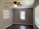 Bright bedroom featuring a window with blinds, ceiling fan and modern hard surface floors at 3803 43Rd N Ave, St Petersburg, FL 33714