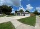 A charming single-story home featuring an attached garage, long driveway, and a well-maintained lawn at 3803 43Rd N Ave, St Petersburg, FL 33714