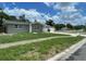 Charming single-story home with a stone facade, well-kept lawn, attached garage and long driveway at 3803 43Rd N Ave, St Petersburg, FL 33714