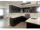 Modern kitchen with stainless steel appliances, stylish dark wood cabinets, and sleek countertops at 3803 43Rd N Ave, St Petersburg, FL 33714
