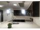 Modern kitchen features dark cabinetry, stainless steel appliances, and quartz countertops with a breakfast bar at 3803 43Rd N Ave, St Petersburg, FL 33714